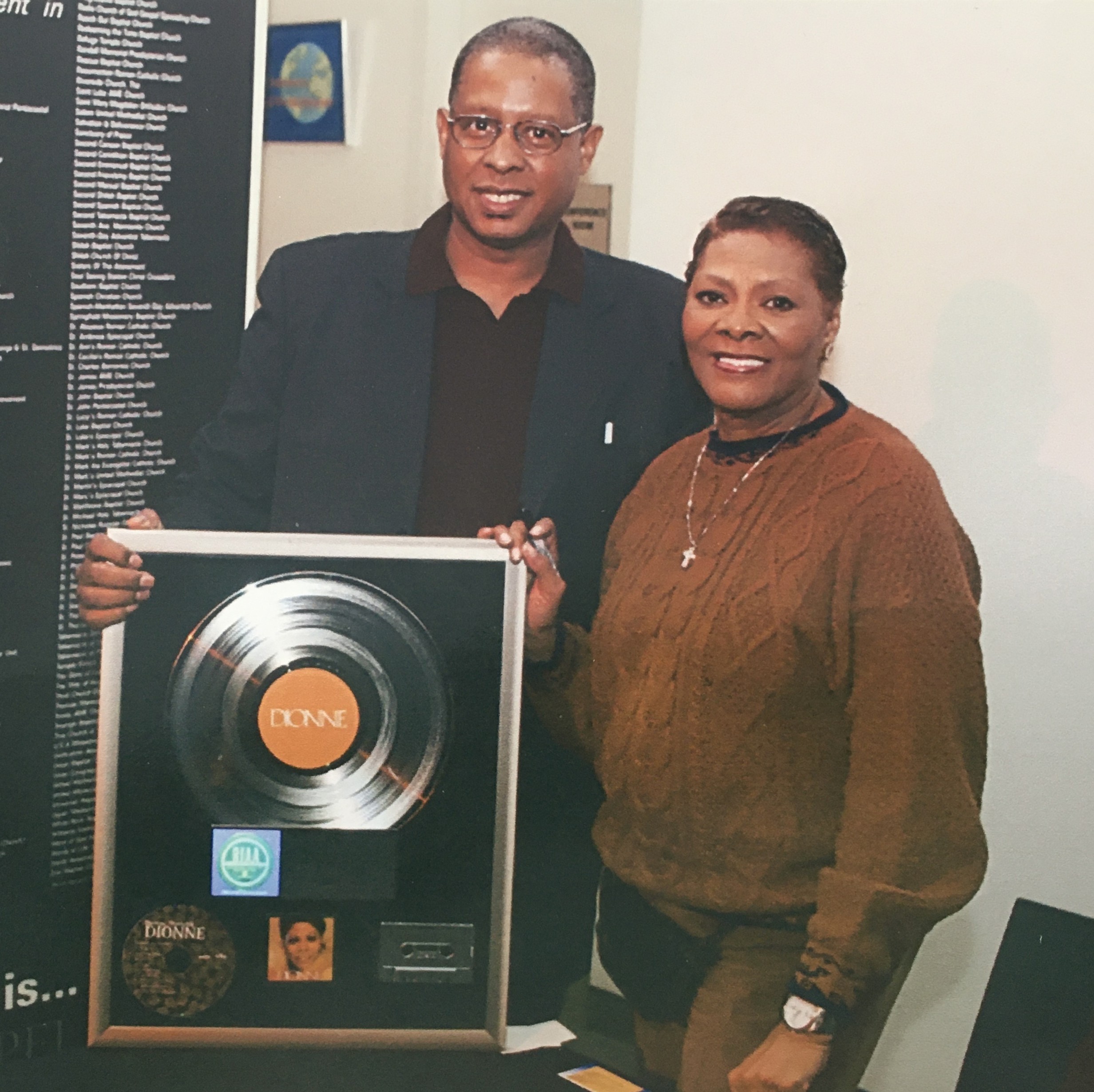 Two people celebrating in an office.